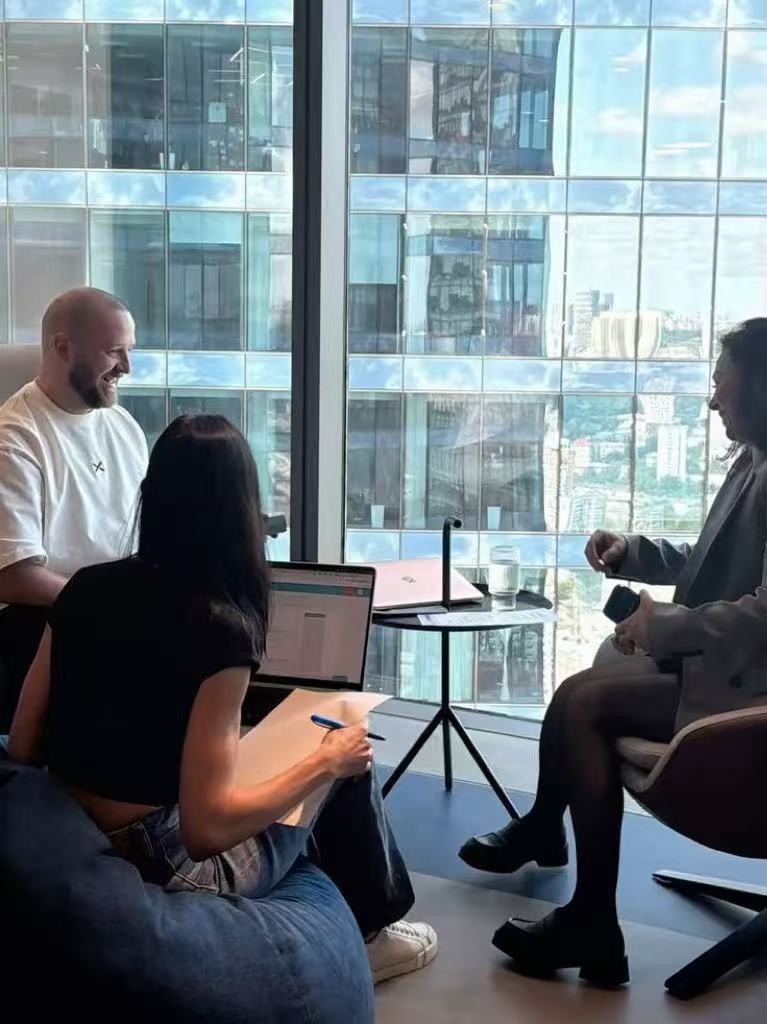 Consultants discussing client priorities during a business meeting